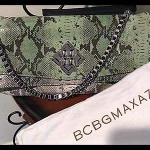 BCBG Maxazria Snake skin clutch with ‘trick’ clasp